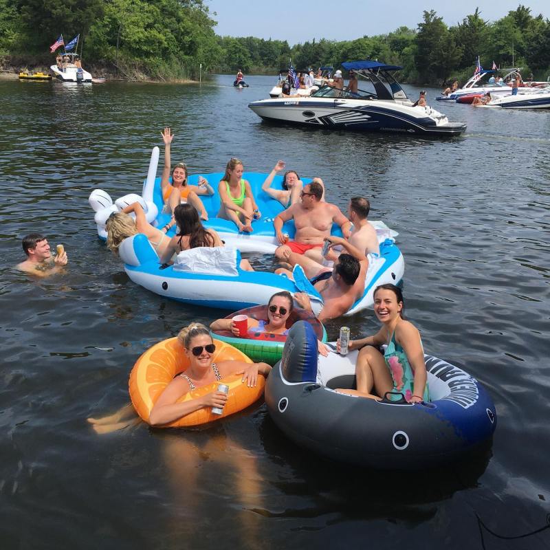 a group of people in a small boat in a body of water