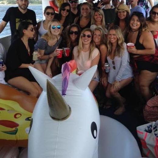 a group of people standing in front of a crowd posing for the camera